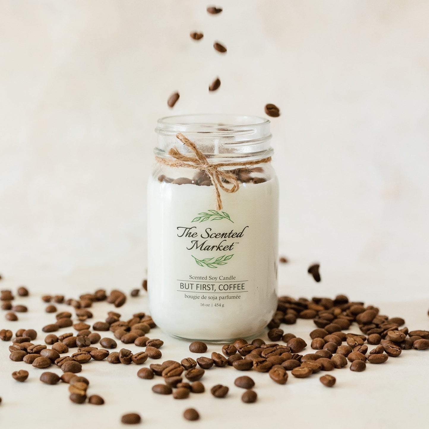 But First, Coffee 16 oz soy scented candle surrounded by coffee beans